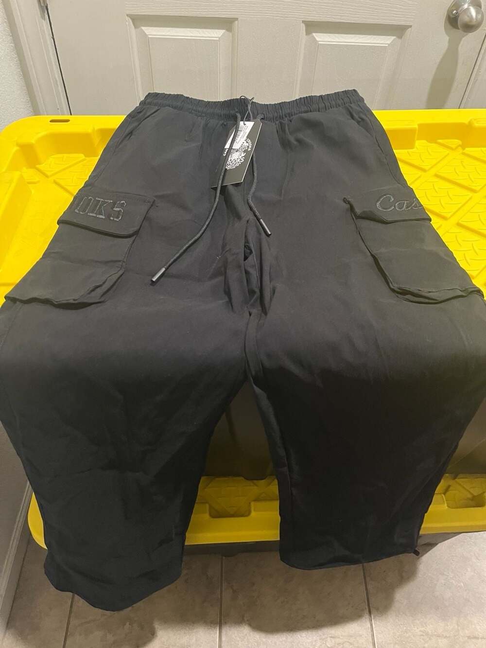 Crooks & Castles Wide Leg Cargo Pants embroidery on pockets draw string ankle.